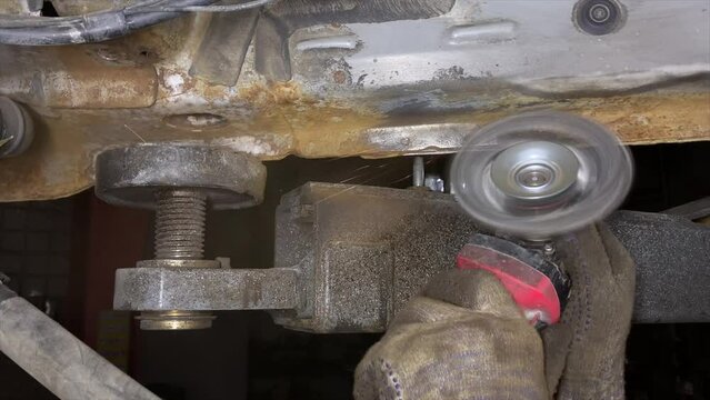 Clean off the rust with a grinder, with a wire brush attachment, Cleaning a rusty car bottom