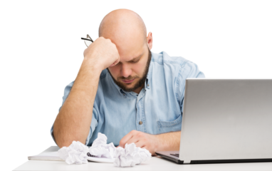 Businessman with stress working on laptop