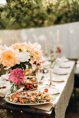 party table details. details of a decorated place for a festive event. table details with flowers and snacks for outdoors holiday