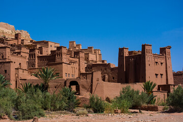 View to the old moroccan town. Wall and towers made from red clay