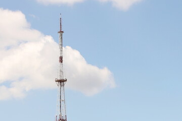 Obraz premium Television and radio tower in Ukraine in the city of Lviv. Technological frame structure made of metal. High radio technologies. Transmission of a radio signal over a distance by wireless communicatio