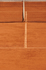 tennis court made of red clay soil with markings for game or competition. sports and recreation, professional performance champions in lawn tennis with rackets and balls. training of athletes outdoor