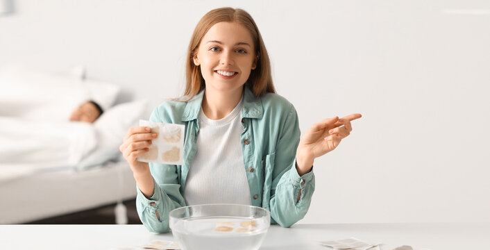 Young woman with mustard plaster at home