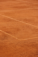 tennis court made of red clay soil with markings for game or competition. sports and recreation, professional performance champions in lawn tennis with rackets and balls. training of athletes outdoor