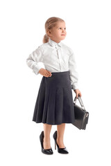 Funny little businesswoman in heels with bag on white background