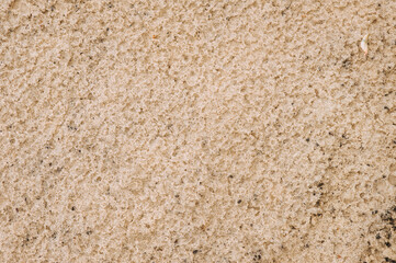 Background, texture of wet dirty sand. Photo of nature, top view, close-up.