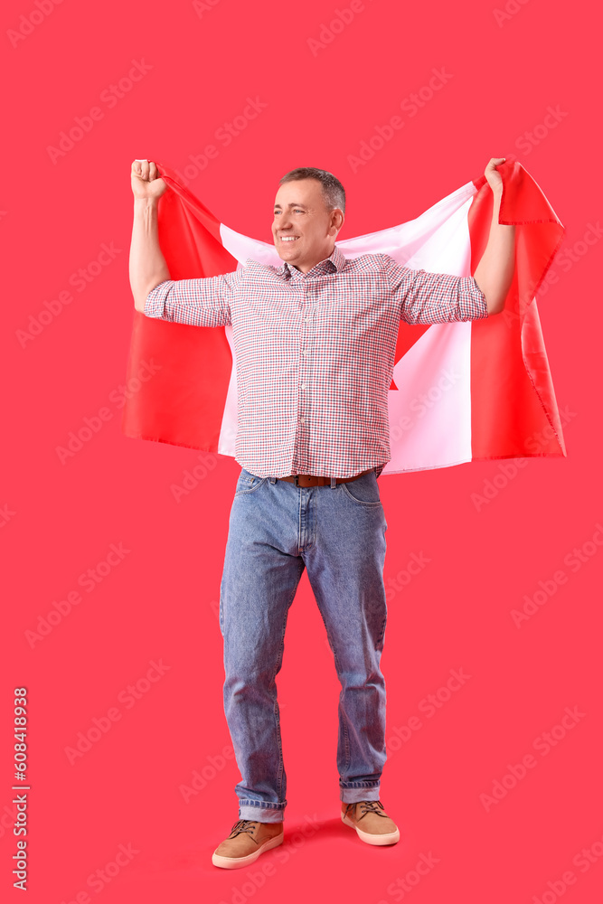 Canvas Prints mature man with flag of canada on red background