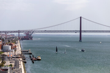 View of the 25th of April Bridge from the Monument of the Discoveries on a summer day in Lisbon