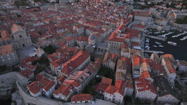 Aerial panoramic drone view of Bay and Dubrovnik Old Town and Harbour at sunset, UNESCO World Heritage Site, from Fort Imperial, Dubrovnik, Dubrovnik Riviera