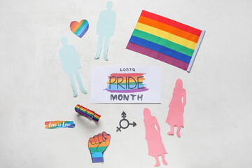 Card with text LGBTQ PRIDE MONTH, paper human figures and symbols on white background