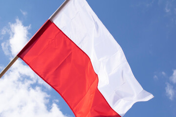 Polish flag against the sky