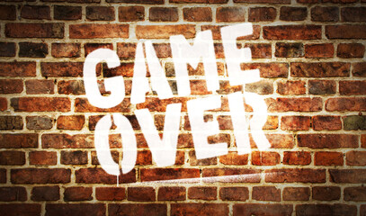 Fototapeta premium Game over symbol spray painted on the brick wall