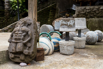 Primitive gym in the jungle with weights and dumbells made of cement