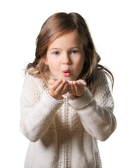 Baby blowing on snow in winter cloth