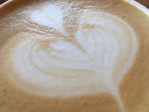 Full frame close-up of a cappuccino with foam decoration