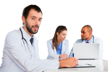 Portrait of Doctors Looking at Laptop and Writing on Clipboard