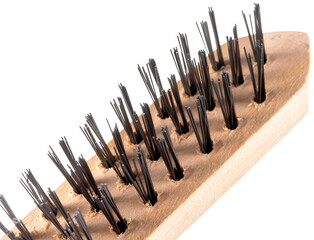metal brush for cleaning metal with a plastic and wooden handle on a white background