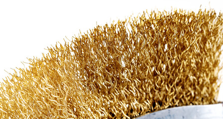 metal brush for cleaning metal with a plastic and wooden handle on a white background