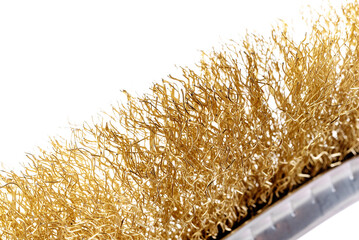 metal brush for cleaning metal with a plastic and wooden handle on a white background