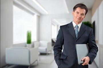 Fototapeta premium Young happy business man worker at office