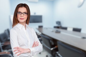 Cheerful business woman with arms folded,