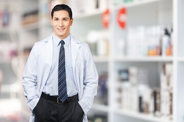 Happy confident young pharmacy worker posing