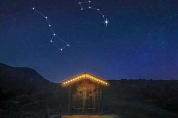 A real night scene on a mountain hut with starry sky showing constellation of big dippper and little dipper and the North Star