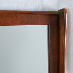 Vintage wooden mirror. Close-up product photograph of the corner.