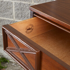 Tall dresser open drawer detail. Mid-century modern furniture. Product photograph in front of an...