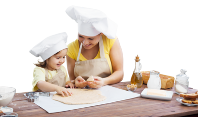 Happy mother and children cooking in the kitchen