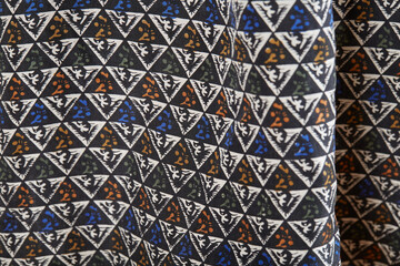 Geometric pattern fabric from a men's silk button-down shirt.