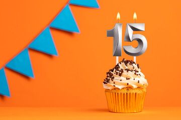 Birthday cake with candle number 15 - Orange background