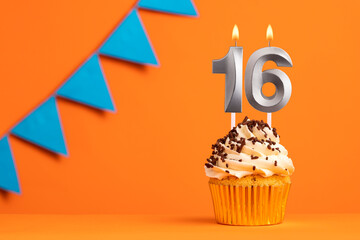 Candle number 16 - Cake birthday in orange background