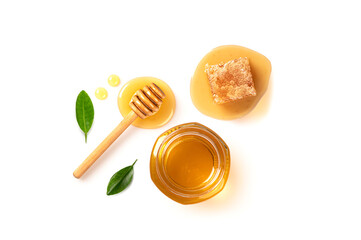 Honey in jar with honey comb isolated on white background. Top view
