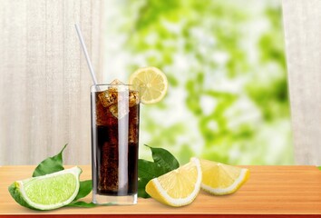 Whiskey with cola drink cocktail and lemon ice.