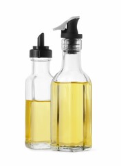 Different glass bottles of cooking oil on white background