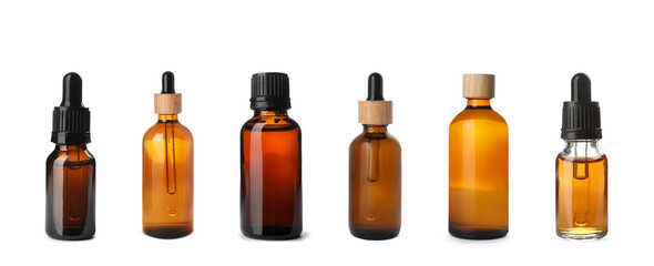 Set of different cosmetic oils in bottles on white background