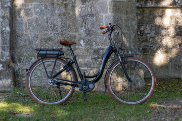 Fototapeta na wymiar Retro bicycle by and old church
