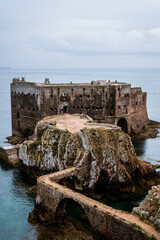 São João Batista fort of the Berlenga Islands of Portugal. Boats in the horizon landscape. Castle in the middle of the water in the Iberian Peninsula.