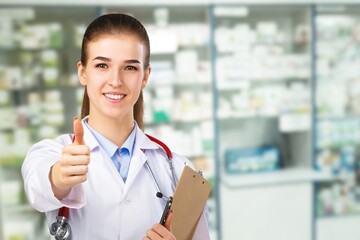 Happy confident young pharmacy worker posing