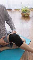 膝サポーターをする膝が痛む男性｜関節痛イメージ