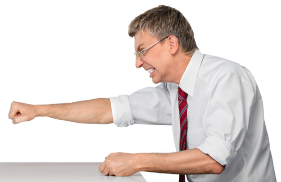 Angry businessman sitting down punching