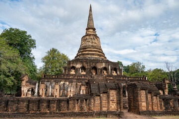 Fototapeta na wymiar An iconic Buddhist pagoda in Wat Chang Lom one of the most landmark in Si Satchanalai Historical Park of Sukhothai, Thailand.