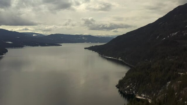 Nature's Majesty: Aerial Views of Shuswap Lake's Calm Waters and Mountain Backdrop