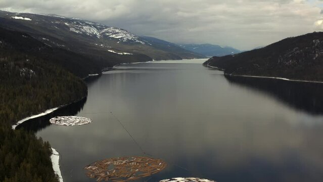 Shuswap's Majestic Canvas: Aerial Perspectives of Cloudy Reflections and Pristine Mountains