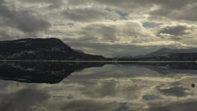 Nature's Mirror: Aerial Shots of Shuswap Lake's Reflective Waters on a Cloudy Day"