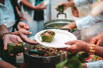 Free food distribution to the hungry in the community : volunteer food donation concept