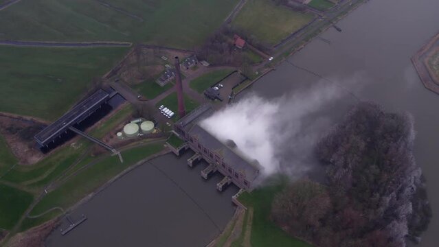 Historic monument steam pump machinery building called Woudagemaal Lemmer, Aerial 4k