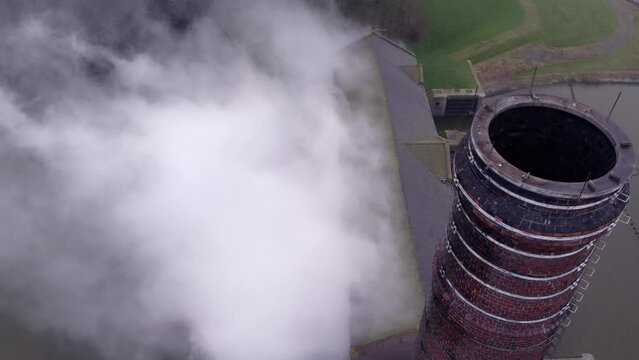 Lemmer, Friesland, Netherlands, flying close to the steam pipe of Steam pumping station Lemmer Woudagemaal, Drone 4k