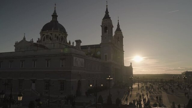 Crowd of People and Catedral de la Almudena during Sunset Madrid, Spain